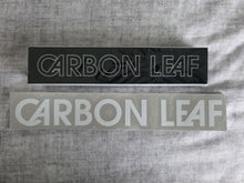 Load image into Gallery viewer, Two stickers with &#39;Carbon Leaf&#39; branding on a gray textured background
